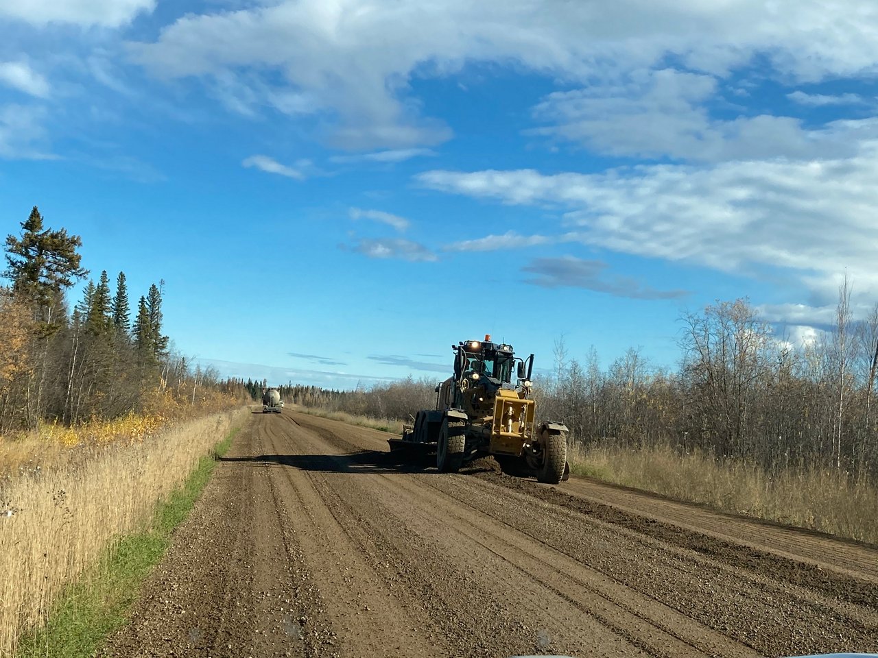 Excavator while maintaining the road for SYD.