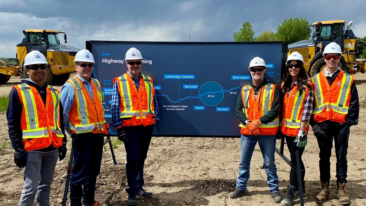 A group of Ledcor employees posing for a group photo on the Highway 3 twinning site