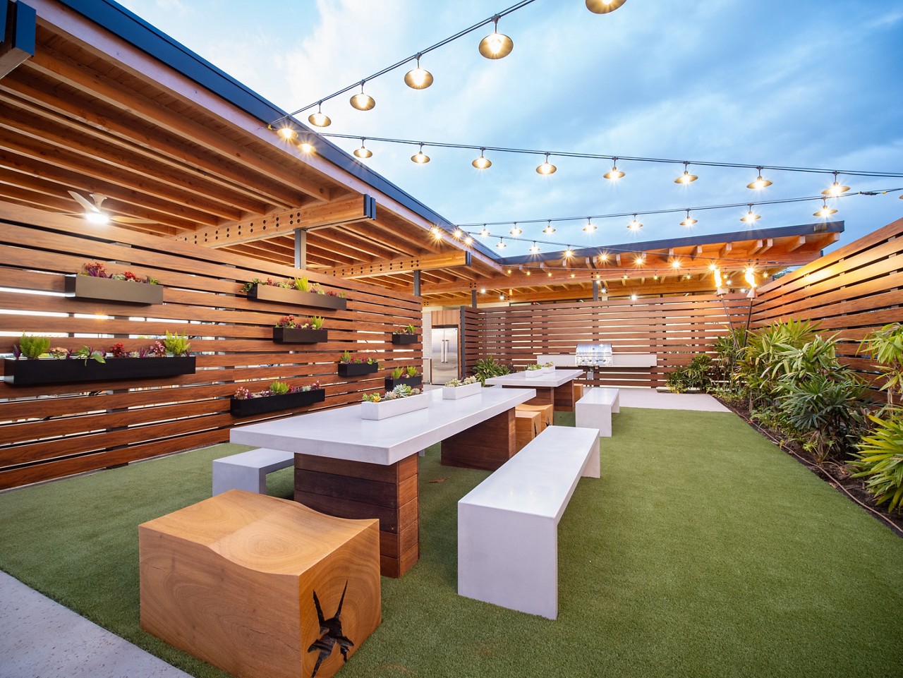 Lai Loa Outdoor Dining Area with tables, benches and decor