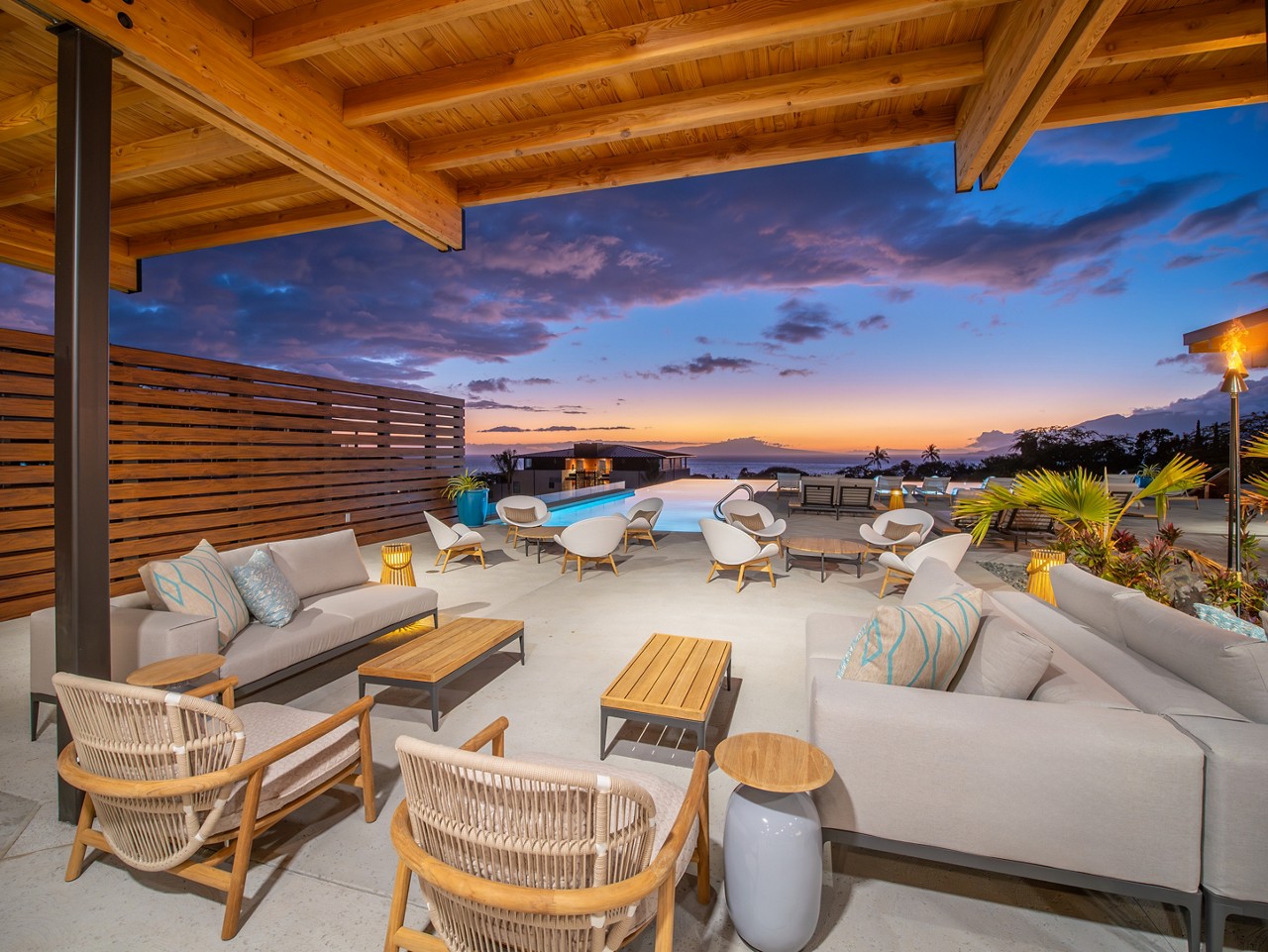 Lai Loa Outdoor Pool Area with chairs and sofas facing the pool