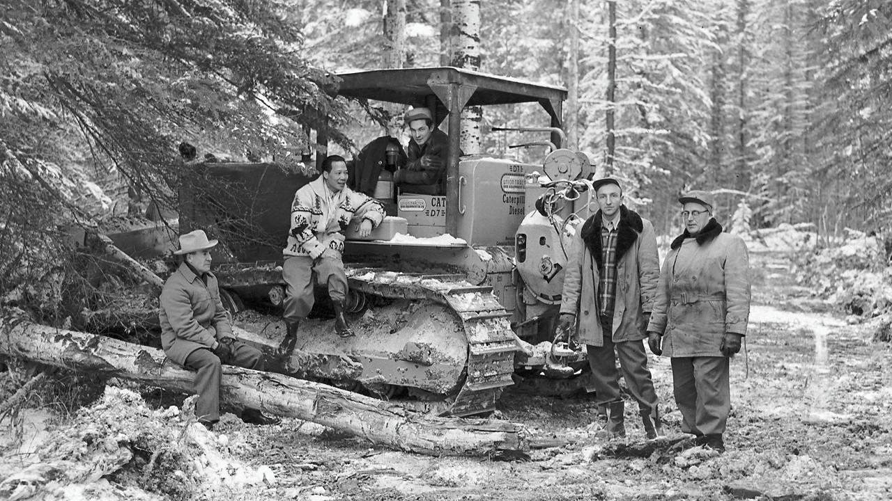 A group of men around a bulldozer