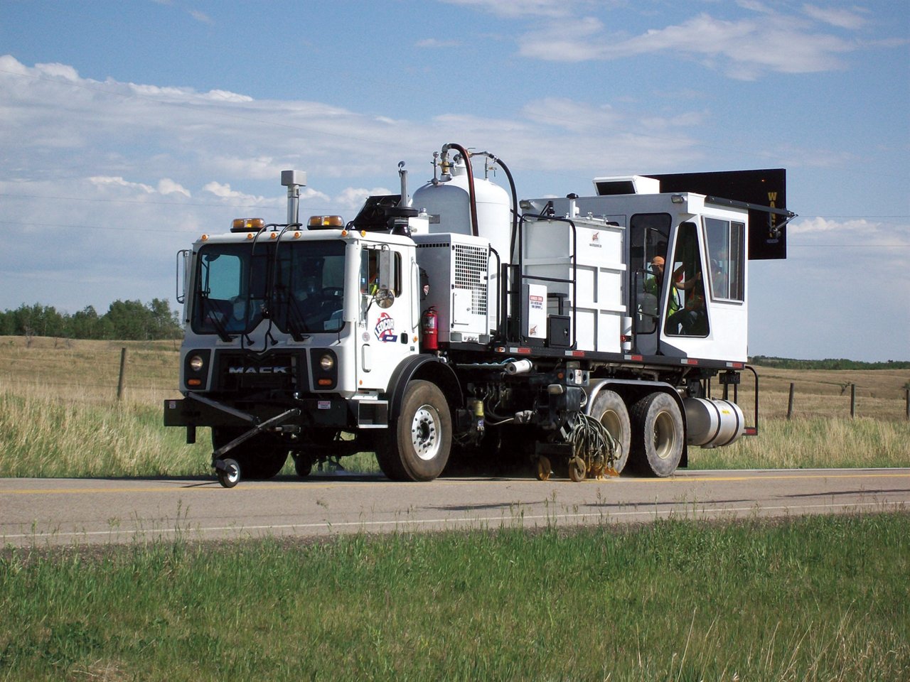 Ledcor's truck painting line on highway.