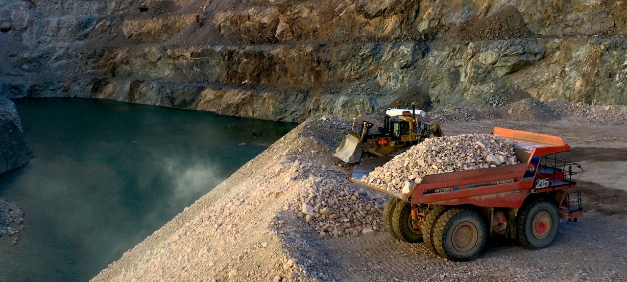 Dump truck bringing load of rocks