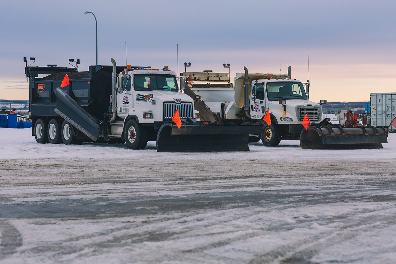 Snow Plow trucks at the site for clearing and maintaining the roads.