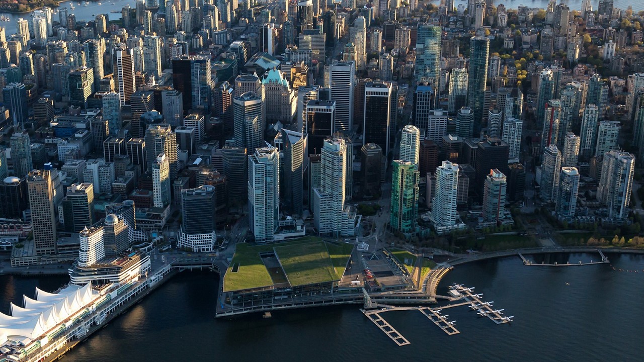 A wide aerial shot of the Vancouver city skyline with the VHFC also