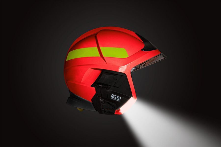 Side view of a red Cairns XF1 helmet with integrated lighting module