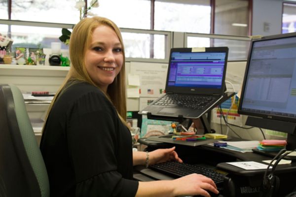 A woman from MSA customer service works at her desk