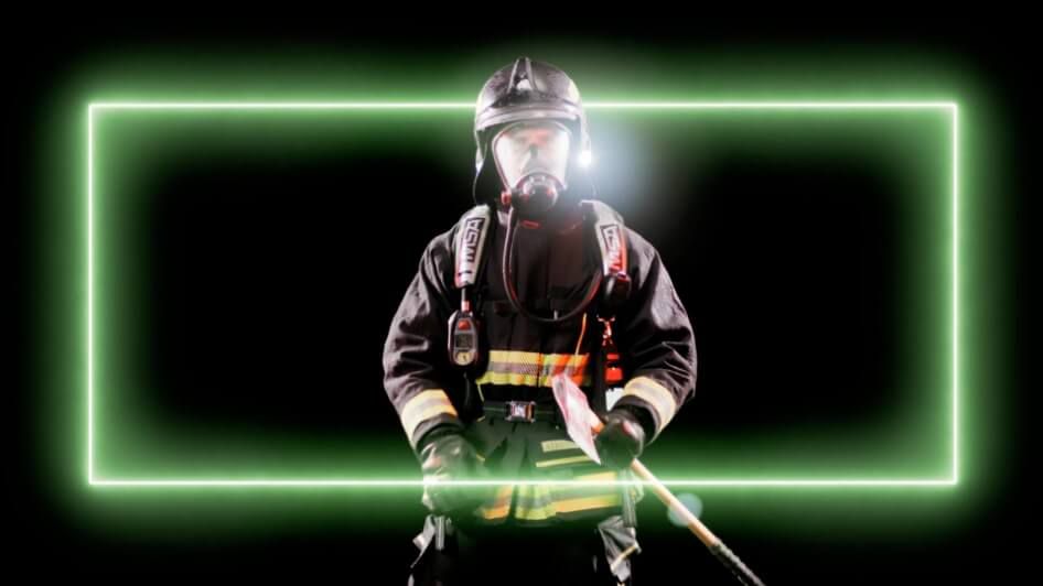 A rectangular neon light wrapped around a firefighter.