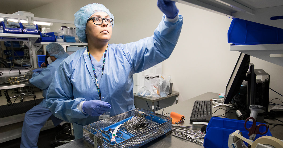 1019 Preparing tray of surgical tools for sterilization