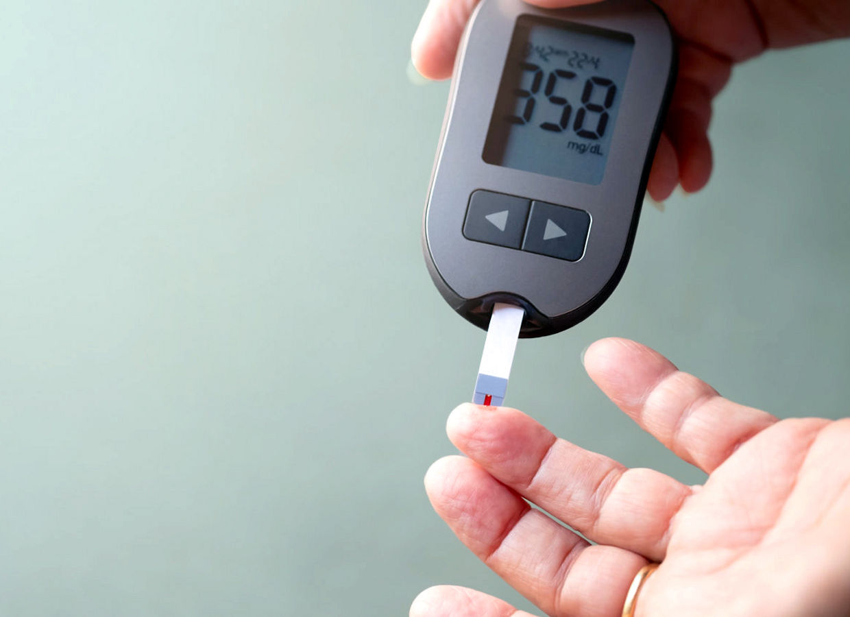 Old women checks the amount of sugar in the blood.  High blood sugar lever