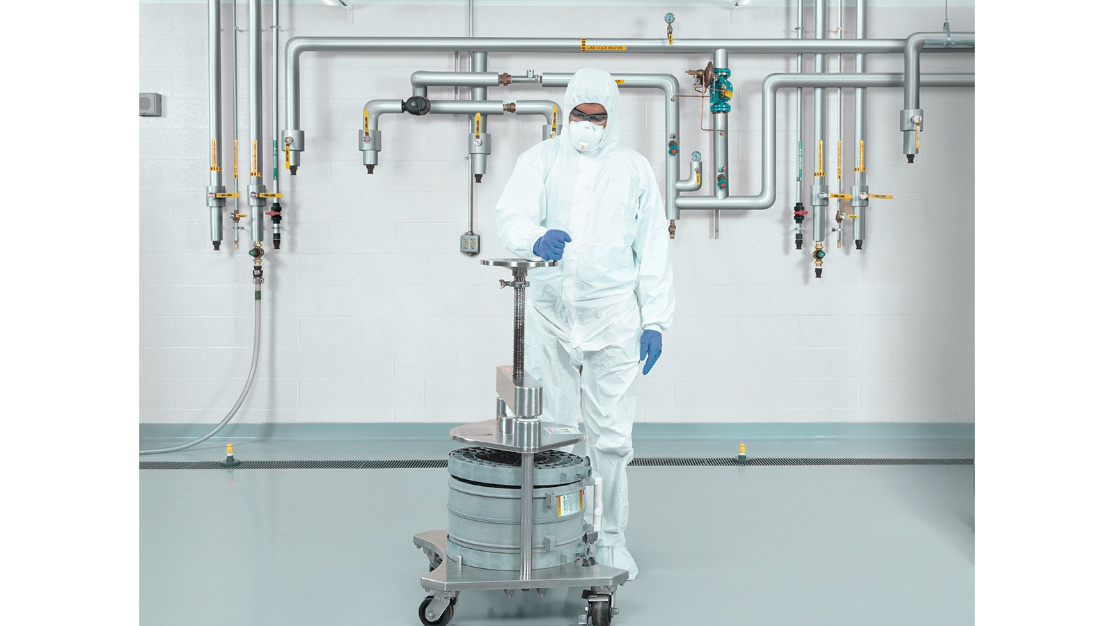  Bioprocessing technician setting up a pilot scale product holder and capsules