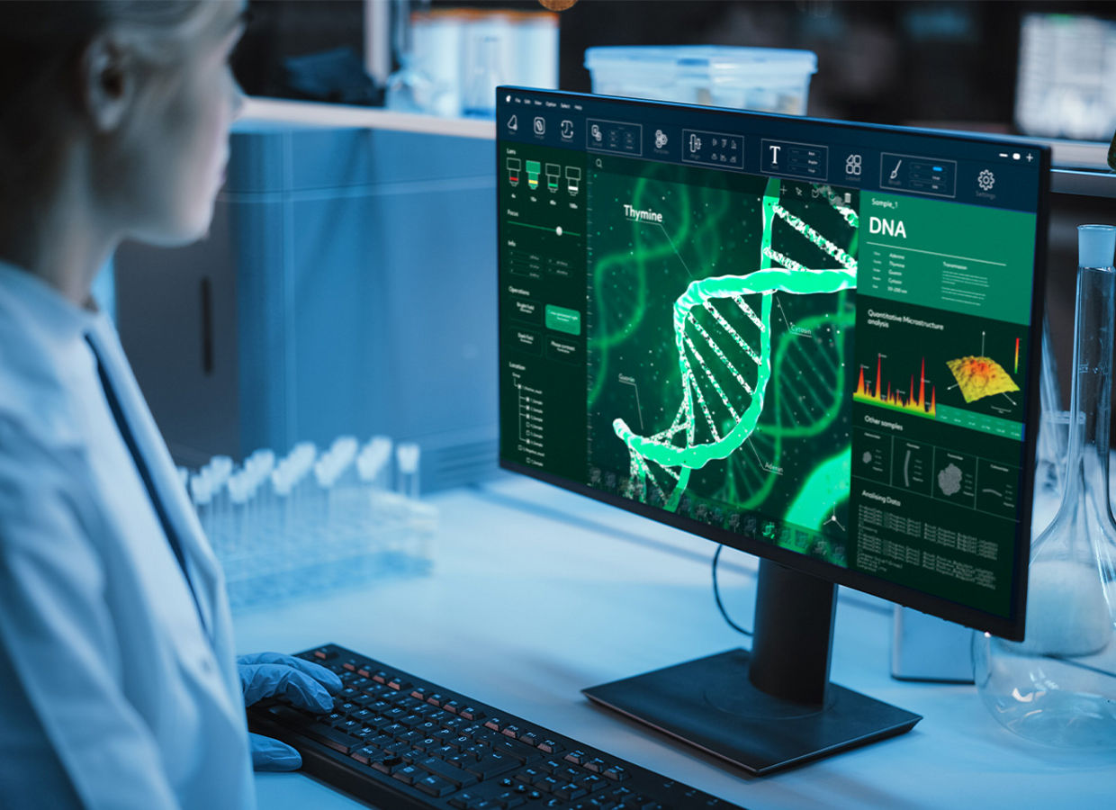 Medical Research Laboratory: Portrait of Female Scientist Working on Computer, Analysing DNA, Virus