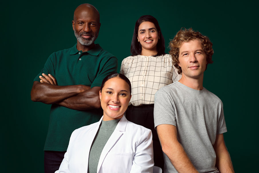 Photo of a enterprise employees. A female application engineer seated, a male HISD employee seated on a stool, male OCSD employee standing alongside an MSD female employee.