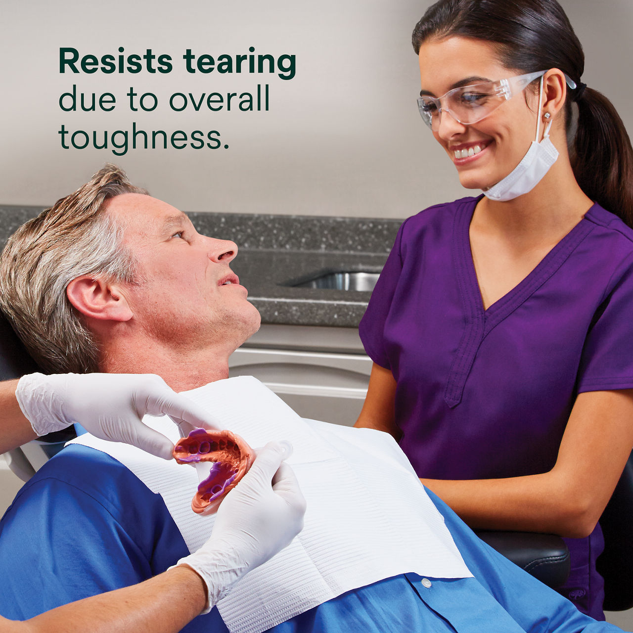 Secondary image 2 for use on Express 2 VPS Regular Set PDP featuring gloved hands holding green and purple quick set dental impression and dentist smiling at patient and "Resists tearing due to overall toughness" text