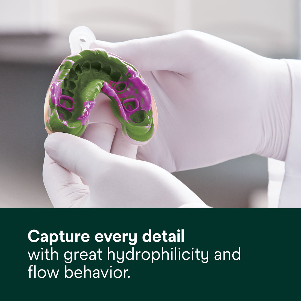 Secondary image 3 for use on Express 2 VPS Quick Set PDP featuring gloved hands holding green and purple quick set dental impression and "Elastic recovery reduces risk of costly mistakes" text