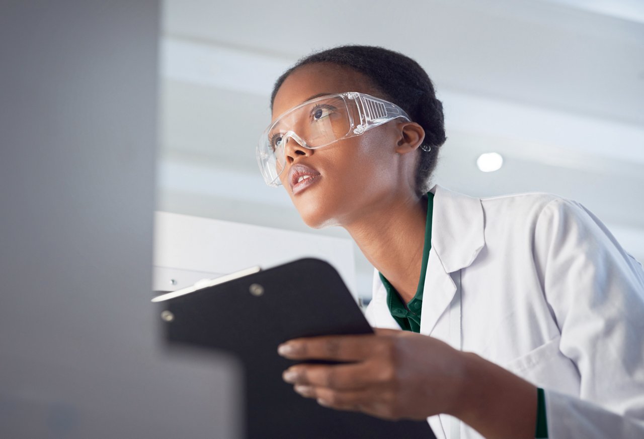 Shot of a young scientist using a computer while conducting research in a laboratory