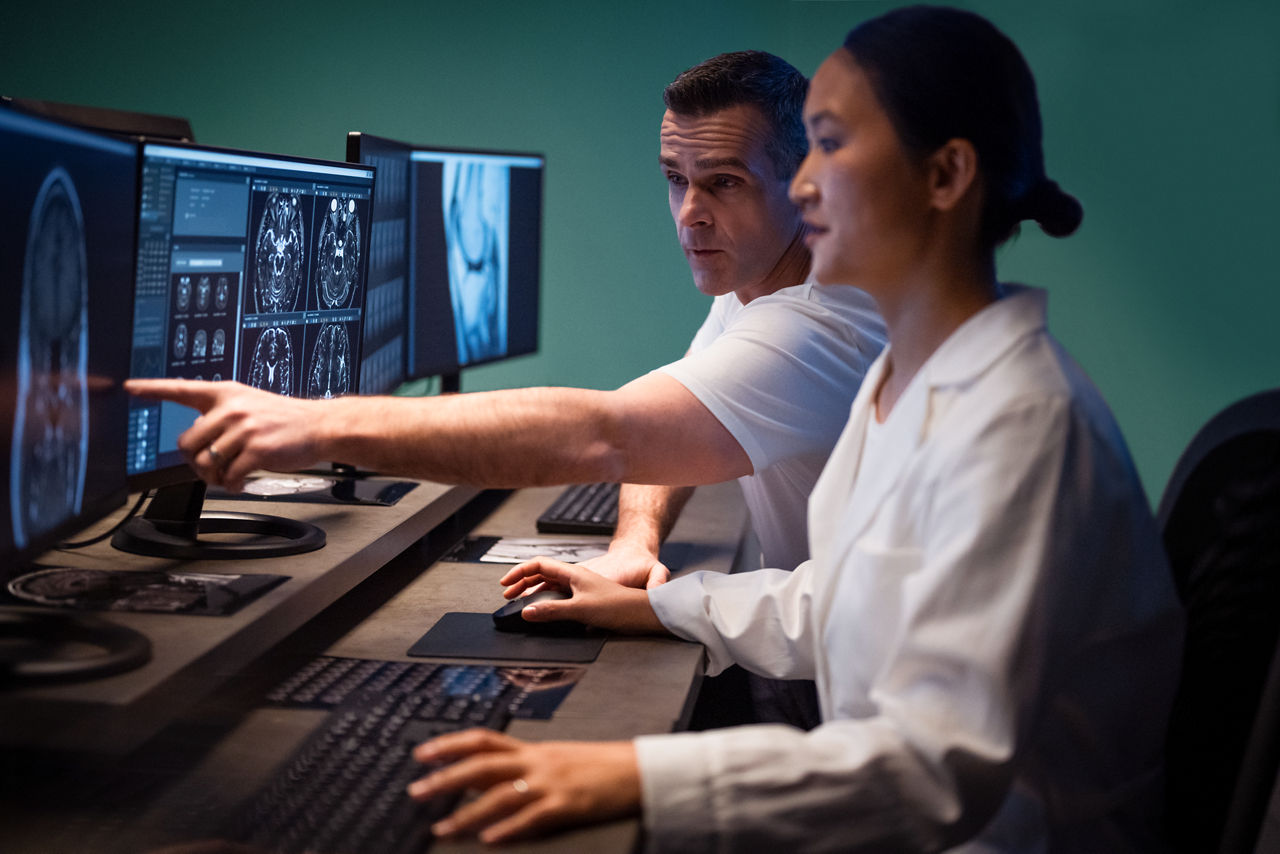 Two physicians viewing a scan