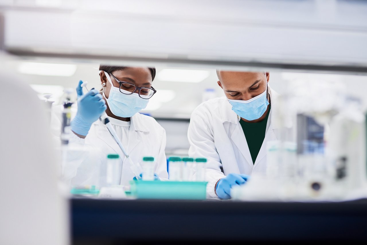 Two male scientists in working in a lab