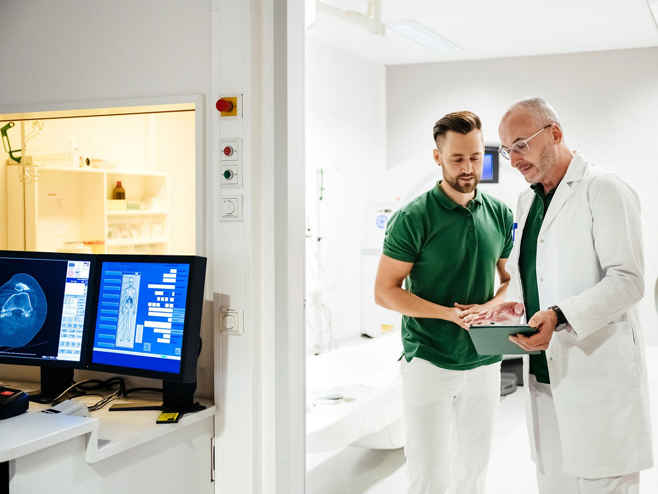 A clinician in a lab coat explaining a file to a patient