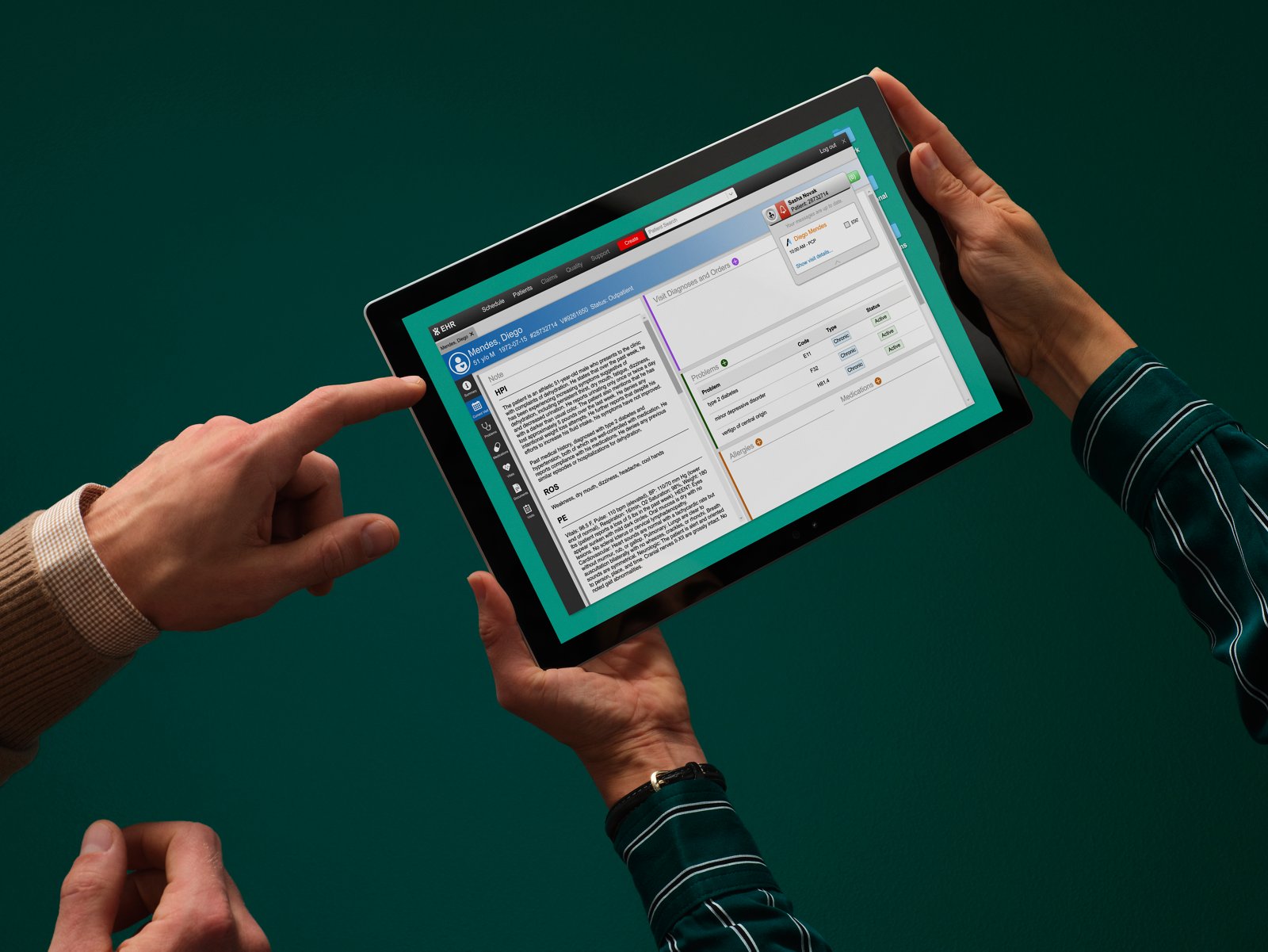 A person holds a tablet with a medical chart on it while another person gestures to the screen.