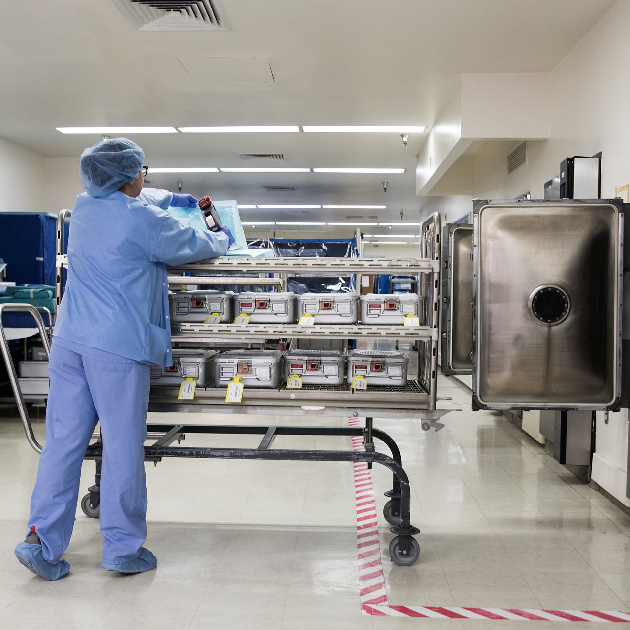 Secondary Image 3 for use on Attest Steam CI 41360 Test Pack PDP featuring clinician with sterilization cart image