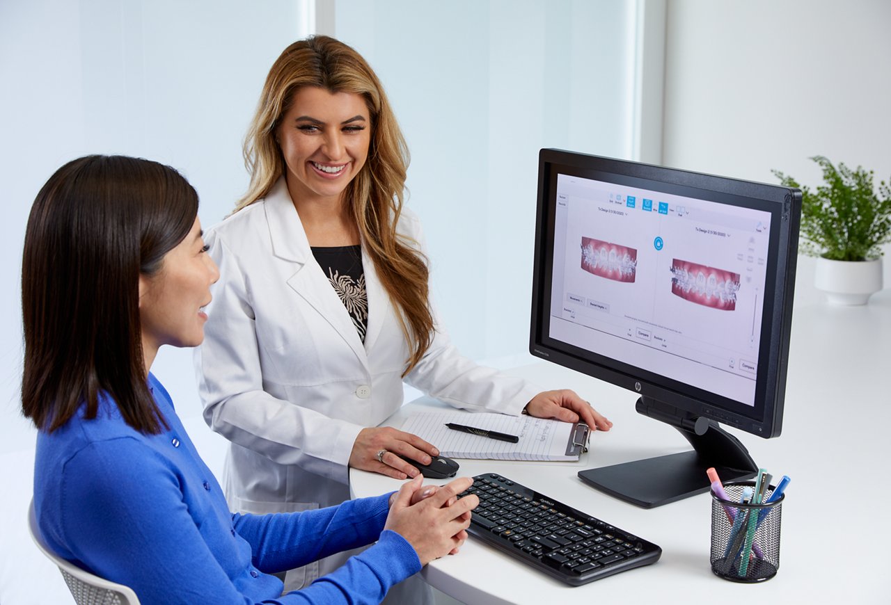 Doctor reviewing tx plan with dark hair patient