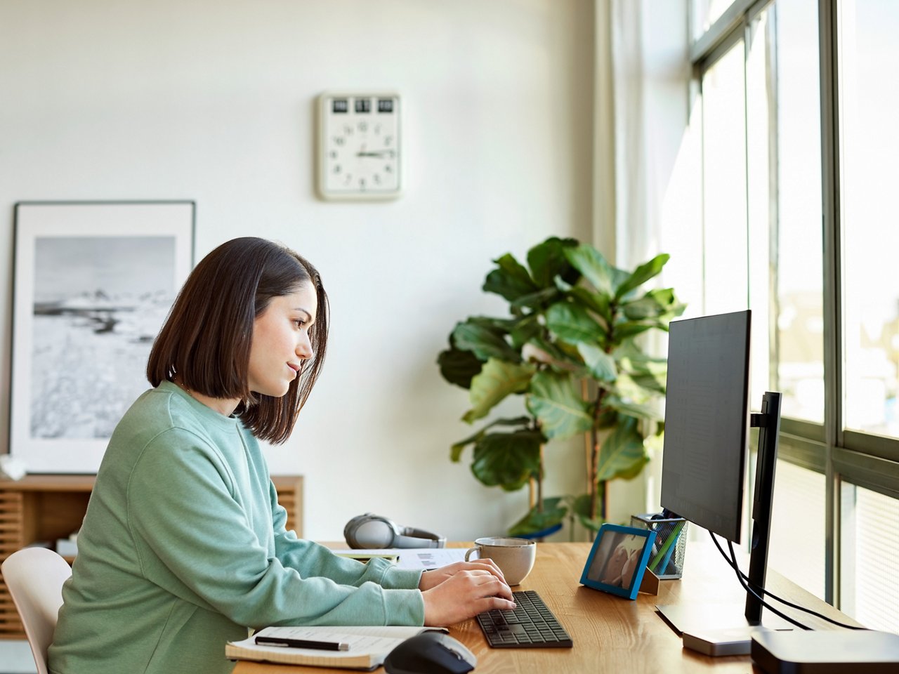 Woman at laptop computer investigates water filtration selection tool