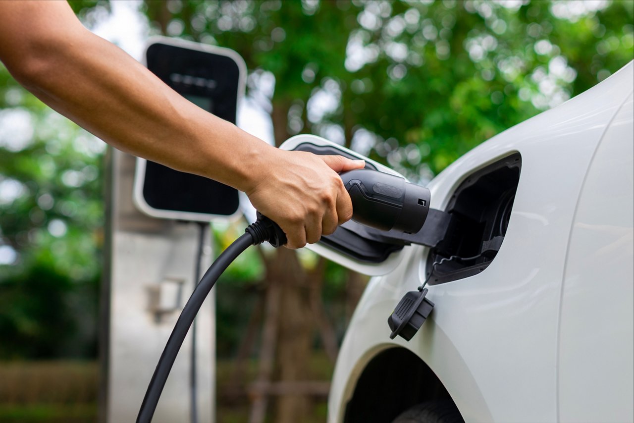 Lihtium-Ion Tech Brief Social Ad8 retouched image of a person charging a white electric car