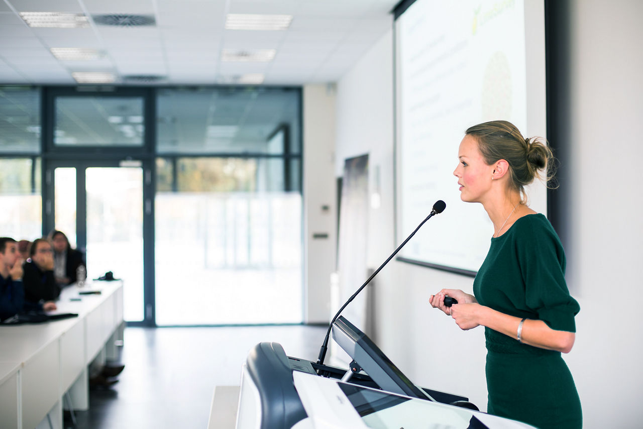 An instructor presenting in a classroom setting.