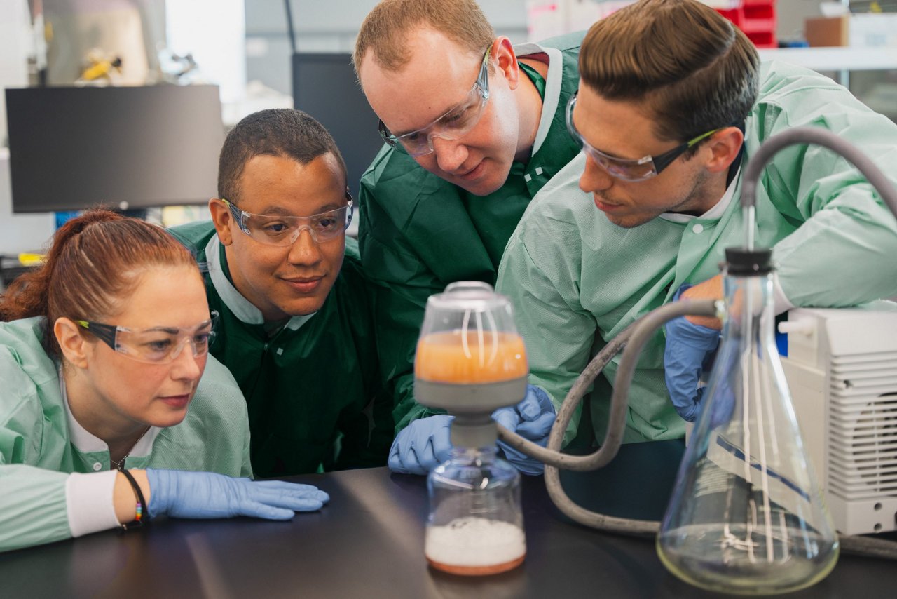 In lab photo shoot of Application Engineering team performing experiments and interacting with 3M™ Harvest RC Clarifier;Model BT500