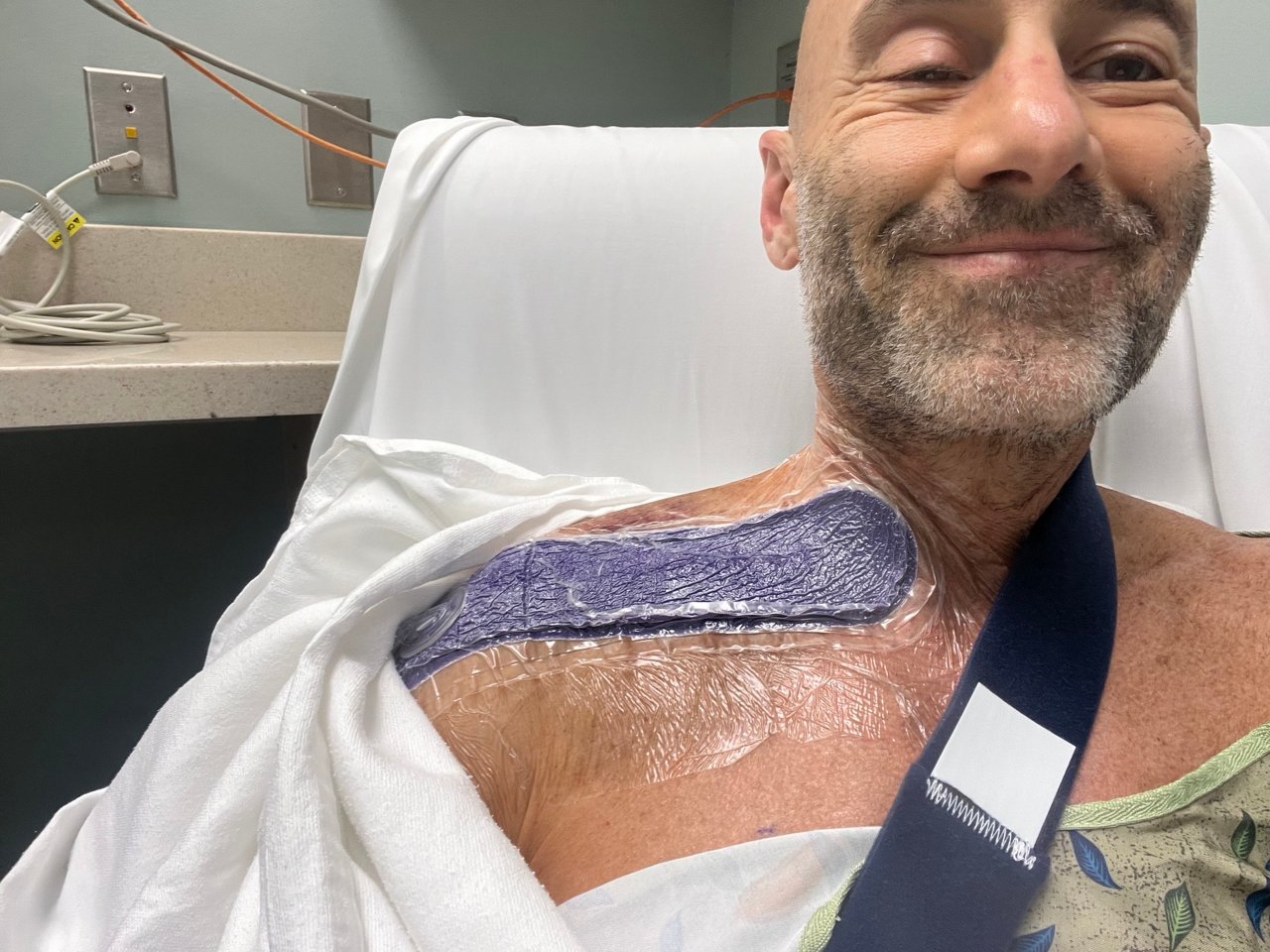 Image of Tommy post check-up wearing Prevena in a hospital bed.