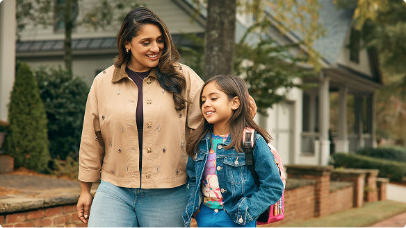 Parent and child walking to school