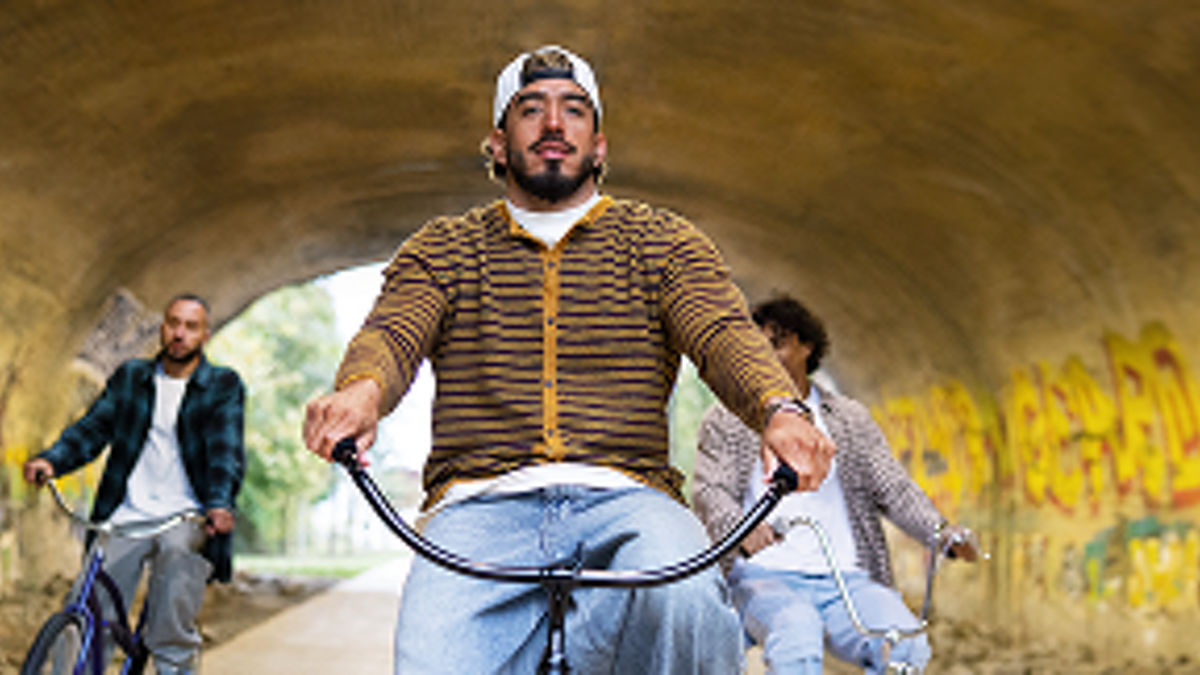 Man riding a bicycle with friends