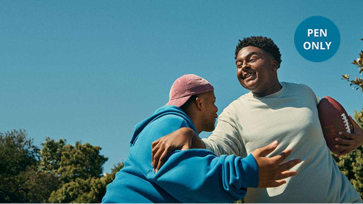Teenagers playing touch football