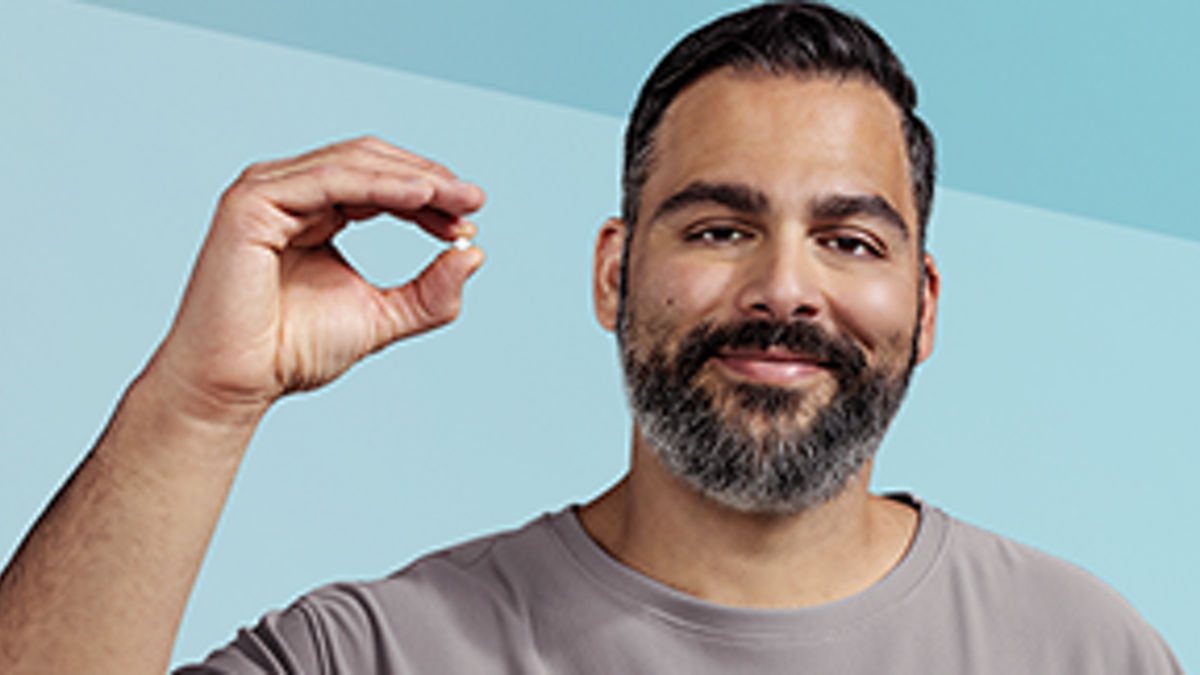 Man holding Wegovy pill
