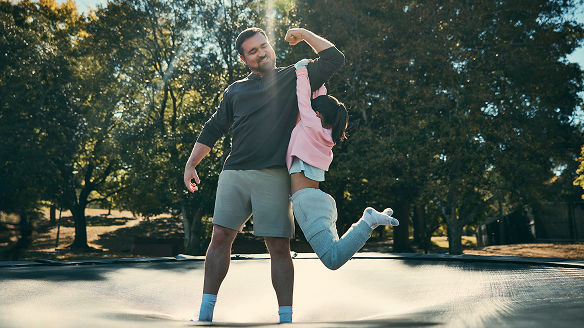 Parent and child playing at the park