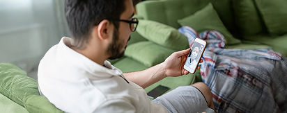 Patient on the phone having a virtual converation with his HCP