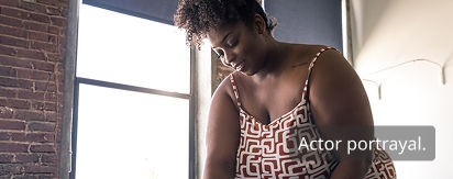 Woman smiling and working on a project