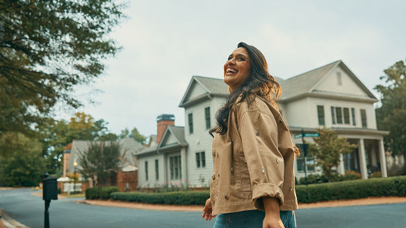 Woman taking a leisurely walk through the neighborhood