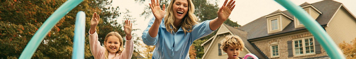 Woman and children hoola hooping