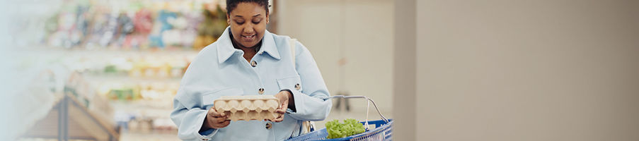 Woman preparing to cook with eggs