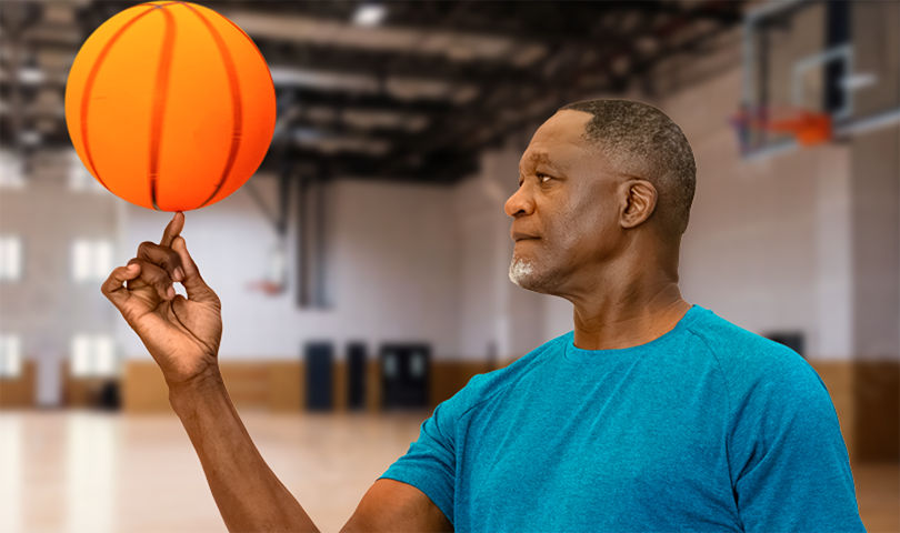 Dominique spinning a basketball on his finger