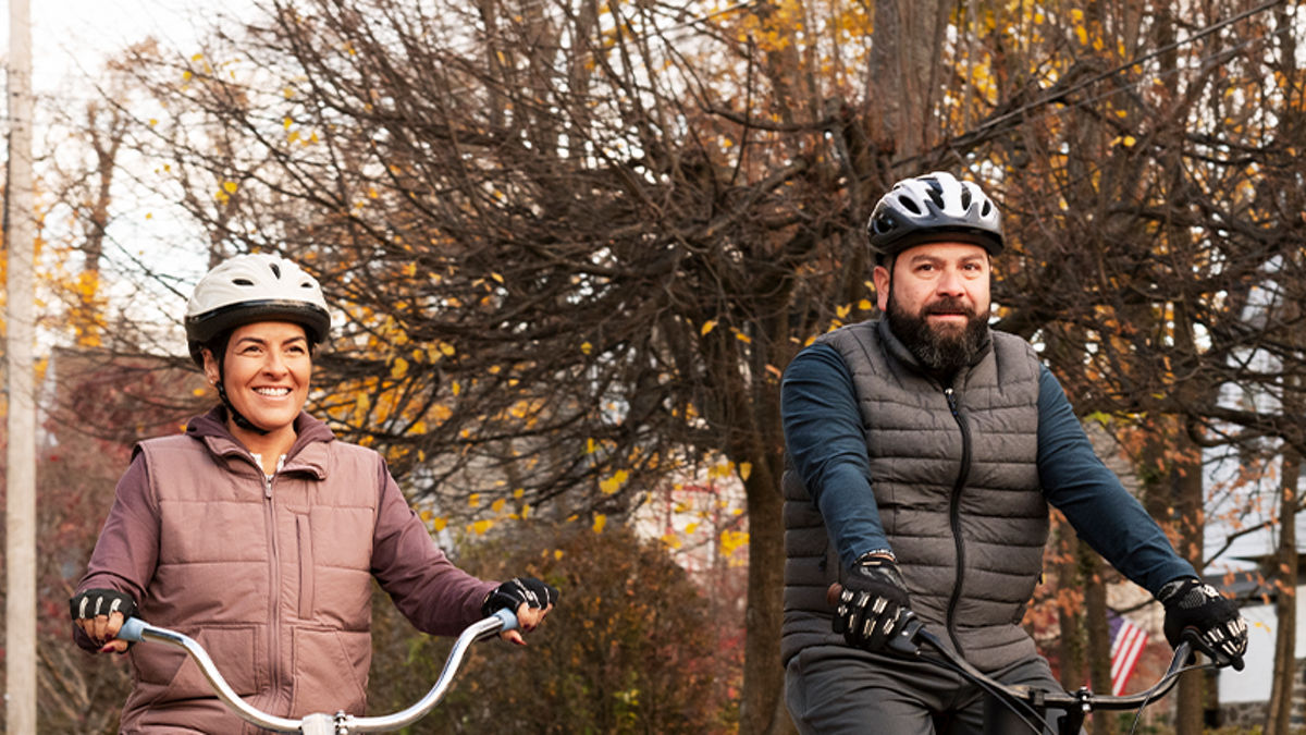 Maria and a man riding bikes together