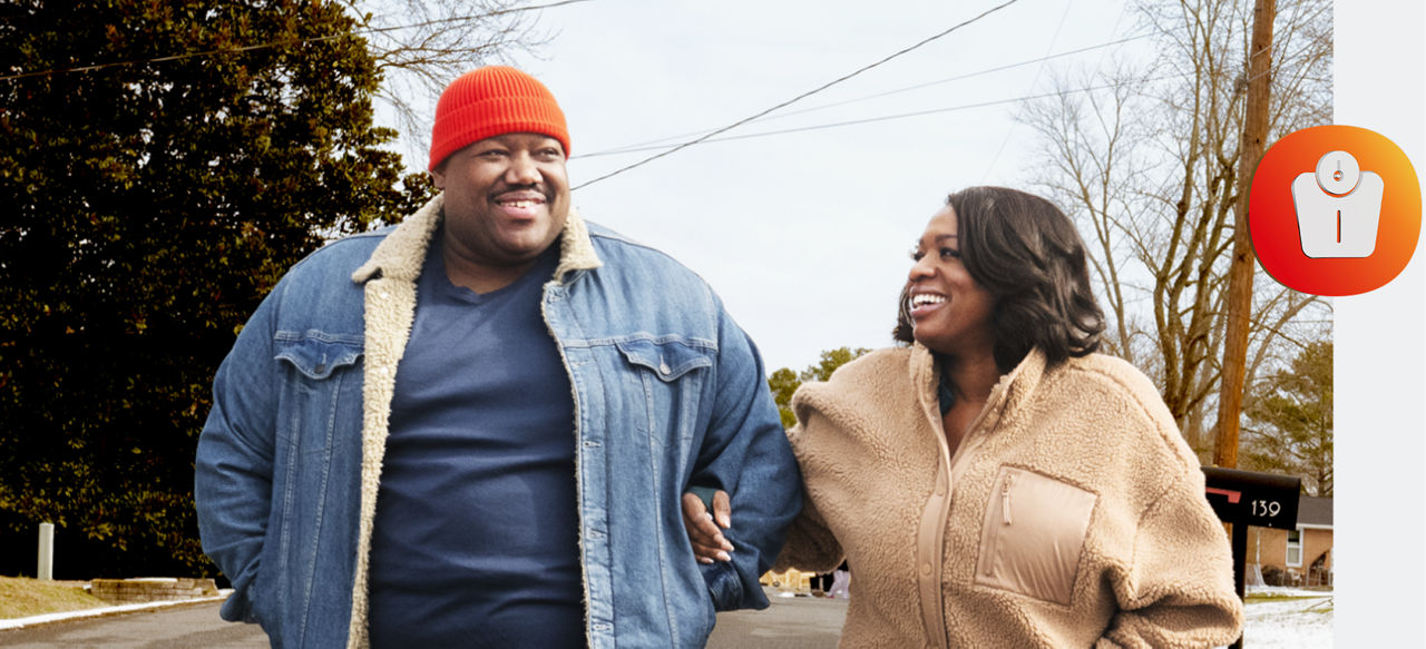 Michael and Tanya smiling and walking