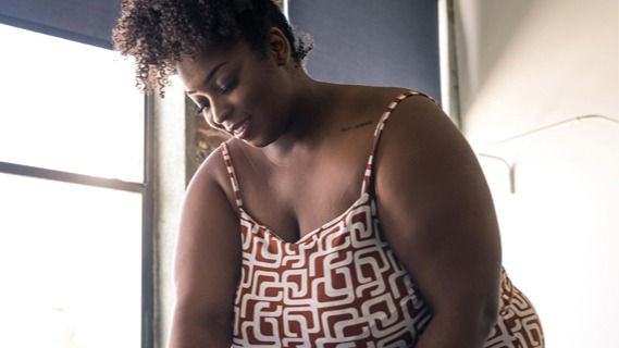 Woman smiling and working on a project