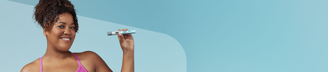 Woman holding Wegovy pen