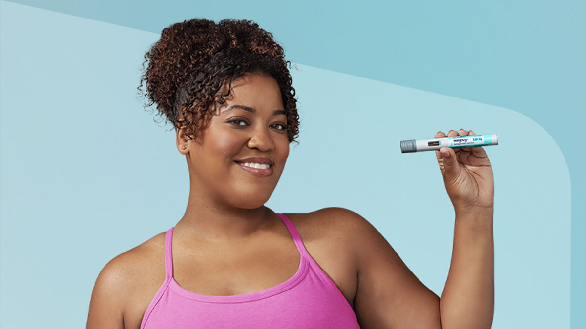 Woman holding Wegovy pen