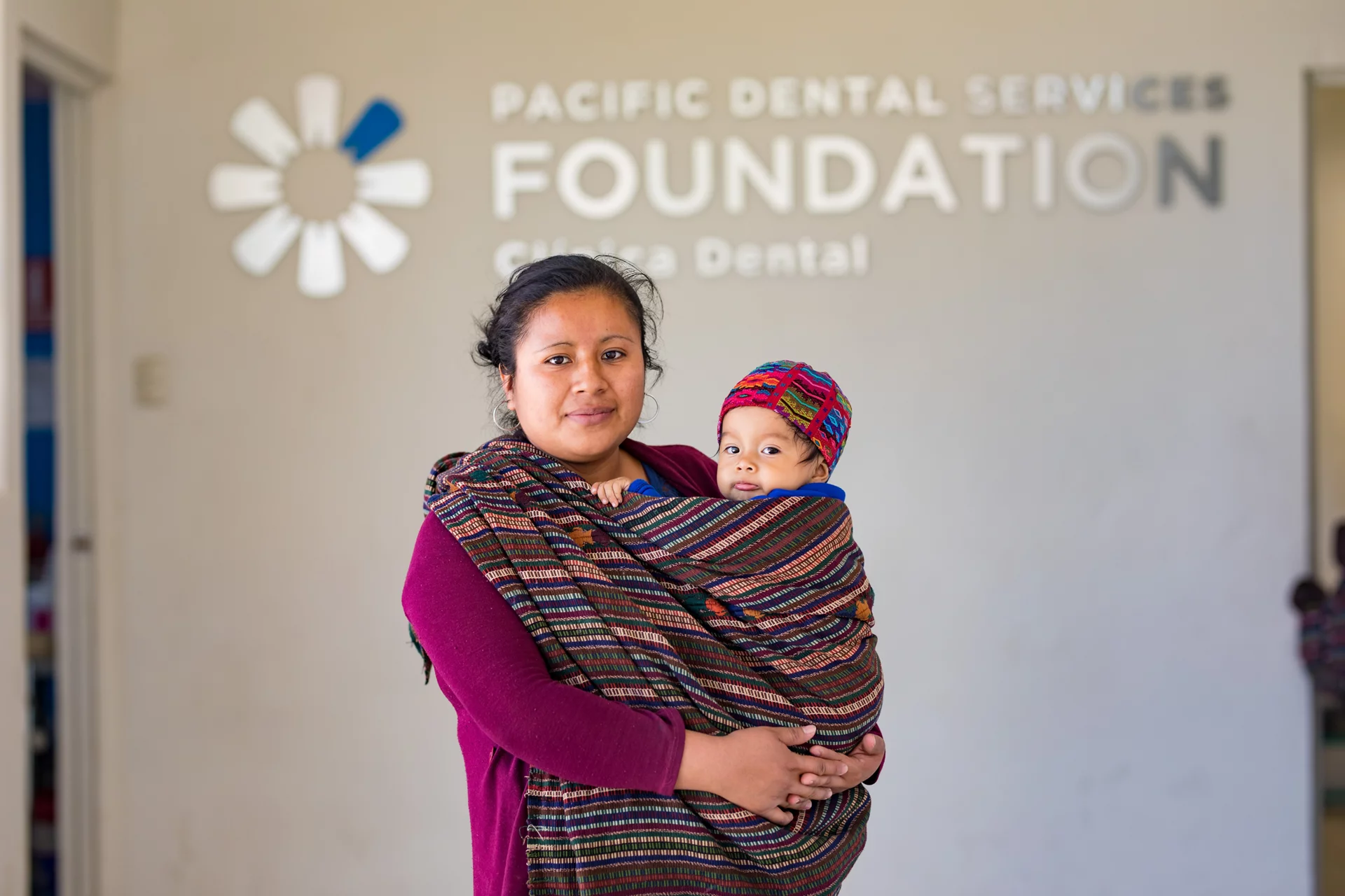 Image of Mother and Child in front of PDS Foundation