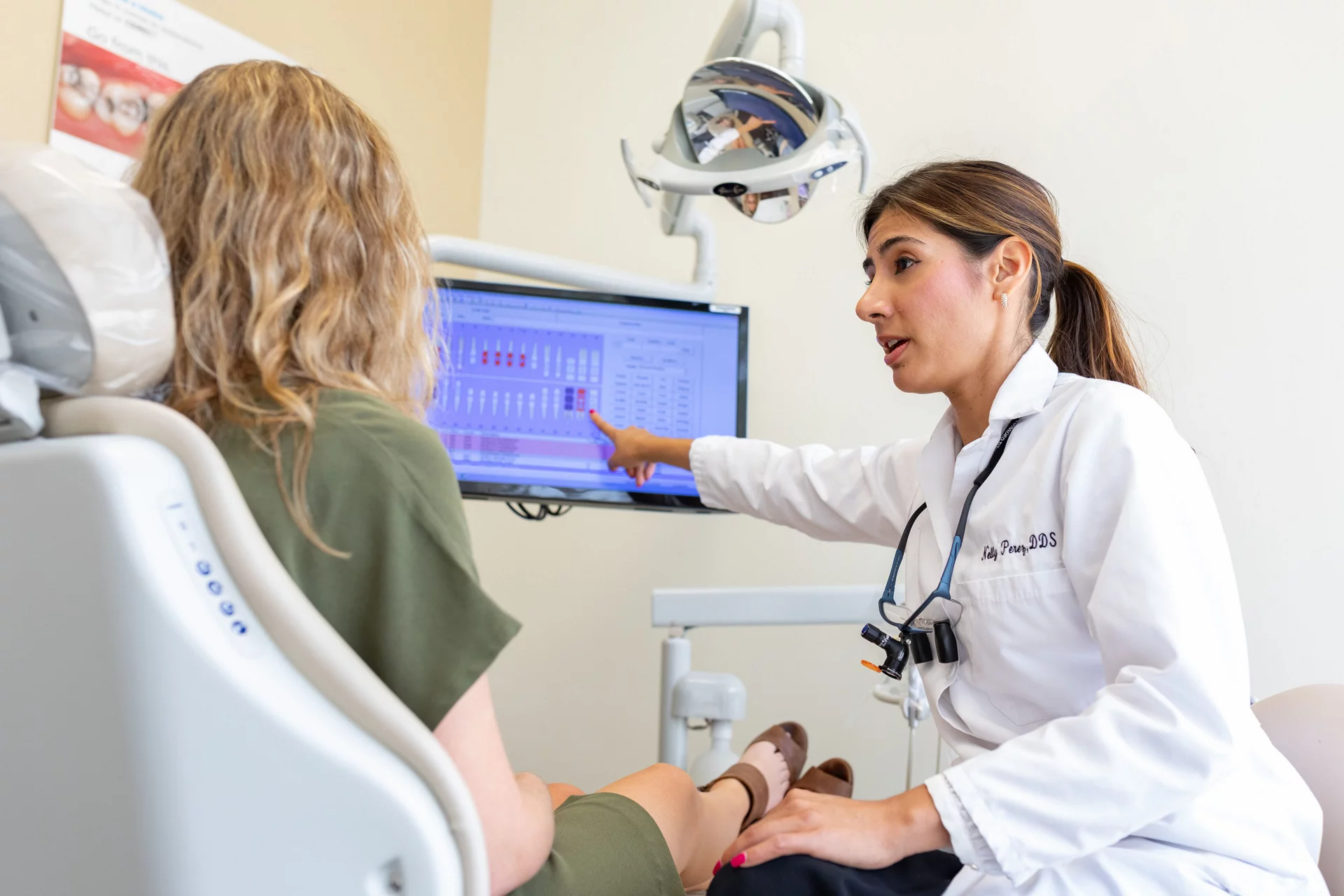 Dentist showing patient charts