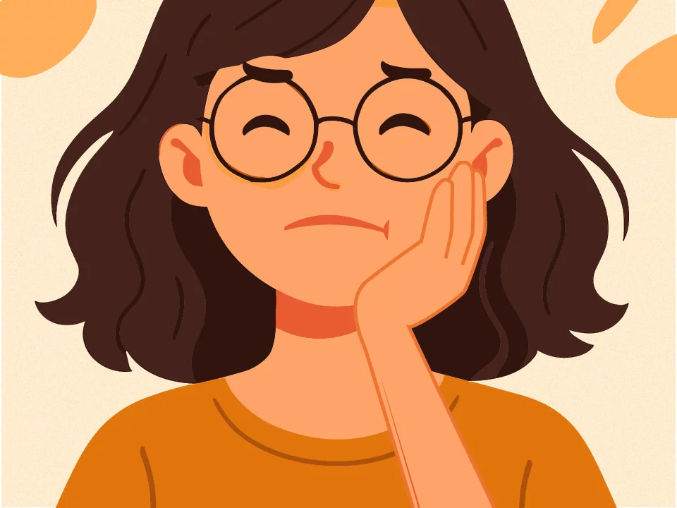 Girl holding hand on sore tooth